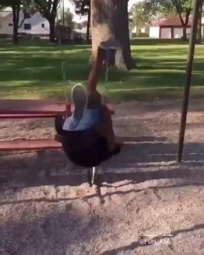 Swinging from a picnic table