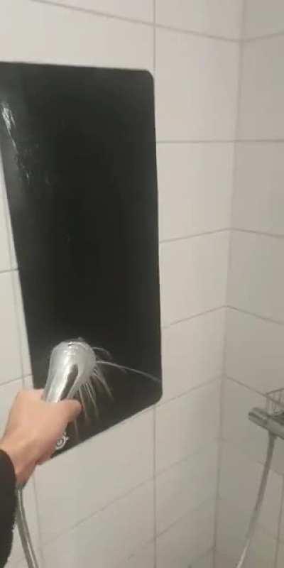 I stick my mousepad to the wall while I wash it