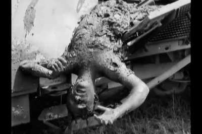Dead crewman on an armored Mercedes-Benz L 4500 truck with 20mm Flakvierling knocked out in Italy near Cori at the end of May 1944