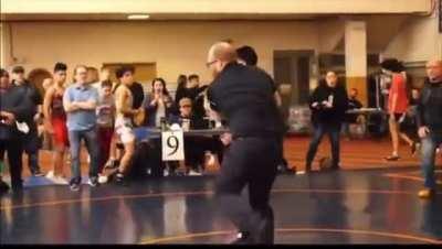 Kid sucker punches other wrestlers after loss.