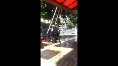 Balancing a ladder on a stack of chairs