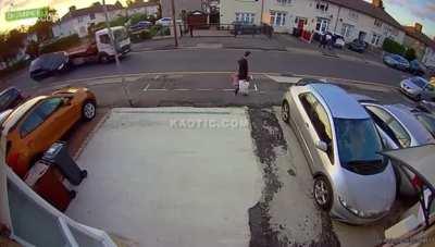 Car clips a truck and rolls over nearly flattening a guy