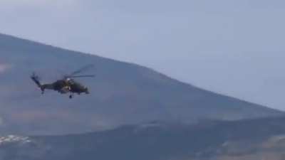 YPG members filming a Turkish T129 ATAK helicopter as other YPG elements shoot at it with small arms. The helicopter circles back and attacks them with a M197 20mm rotary-cannon, Northern Syria, circa 2021.