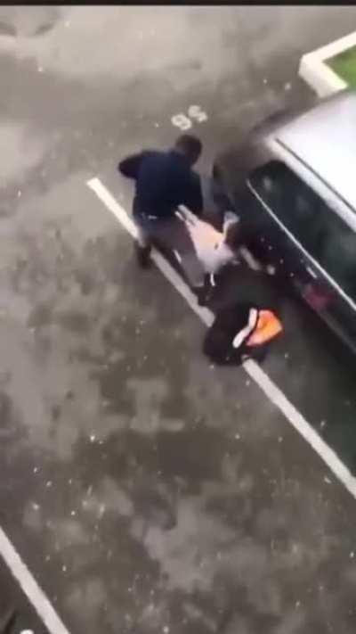 Angry woman attacks car, gets taken out by a dude