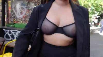 This woman shows her tits in the street without any problems