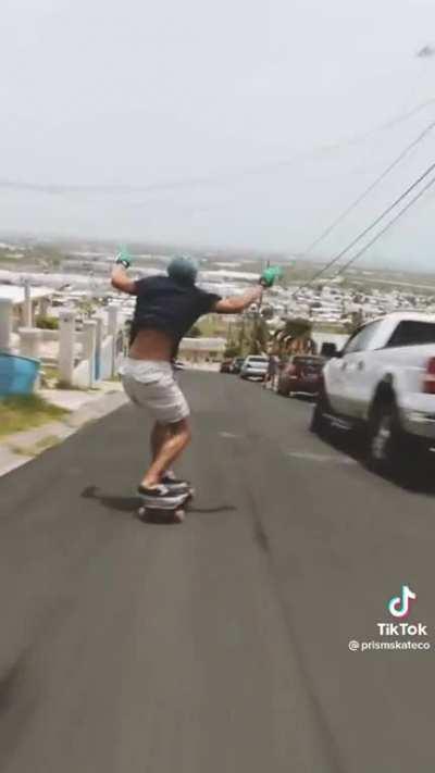 The way this guy controls his longboard on a steep hill is amazing