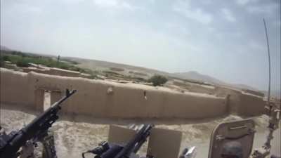 TIC, JSOC Rangers support ANA commandos as they come under fire using a Vulcan, M320 [Tractor respect], and an MK19 CROWS in MRAPs in Afghanistan (Date Unknown).