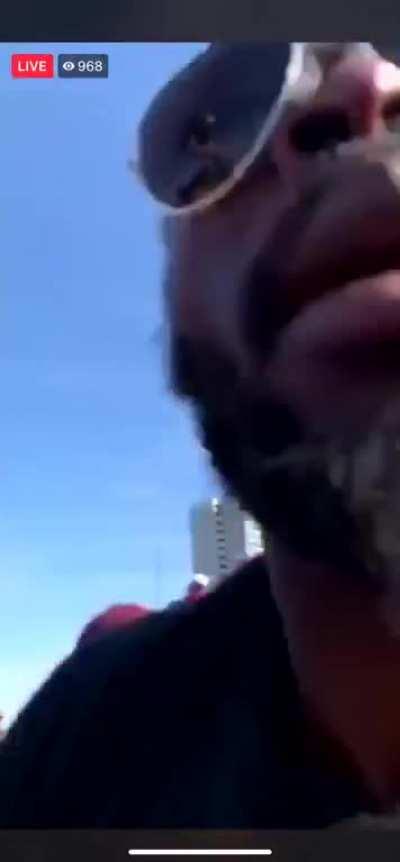 Demonstrators chase down truck that drove through the crowd and drag the driver out. Mayhem ensues.