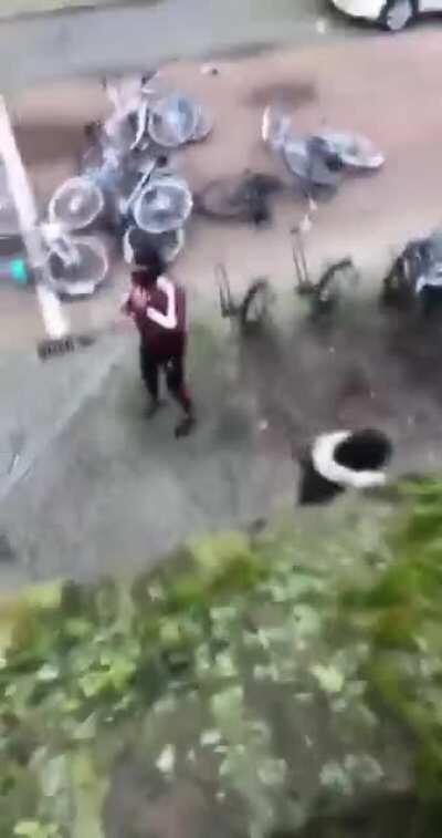 Rioter outside my house in Eindhoven throws bike away, then puts it back because my roommate asked nicely