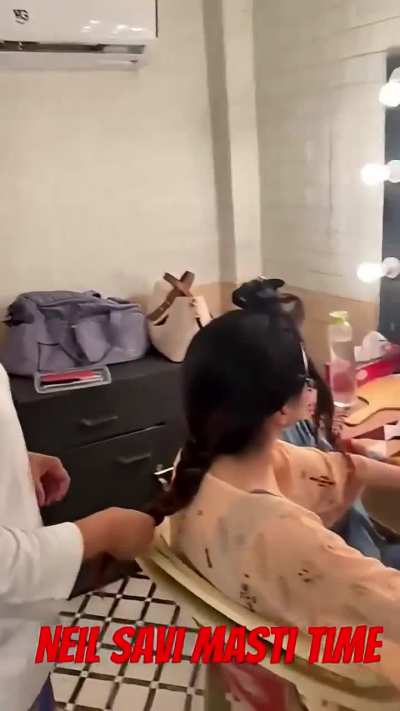 param applying nail paint to bhavika in her make up room