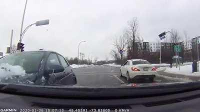 Driving around with a windshield covered in snow