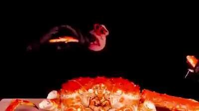 Monkey man eating crab