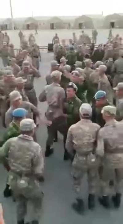 Kazakh and Tajik soldiers dance to Uzbek music during military exercises in Central Asian countries and Azerbaijan