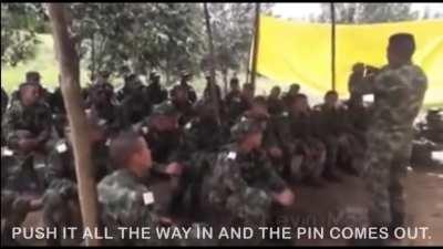 Instructor teaching a class how to use a grenade plays a prank.