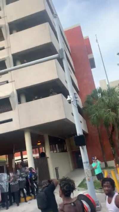 Peaceful protest at Miami police department turns violent as police rain tear gas on us protesters. Tear gas hurts like a bitch