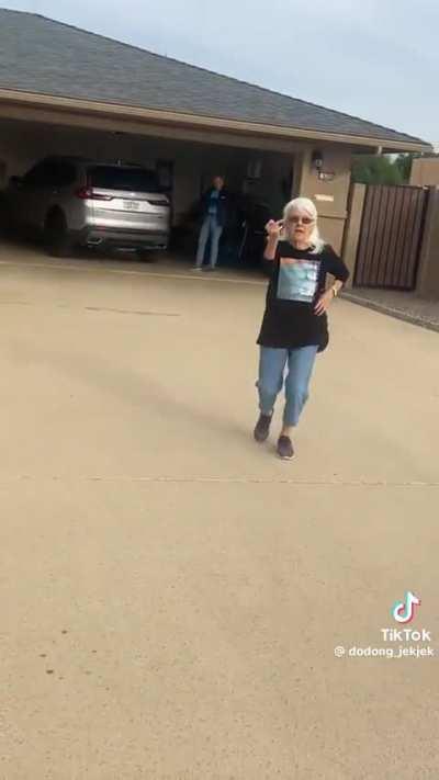 Shooing away a door to door salesman