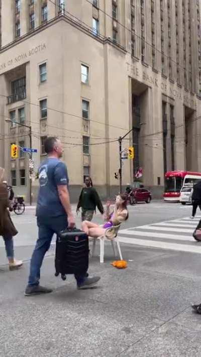 Sitting on a busy street