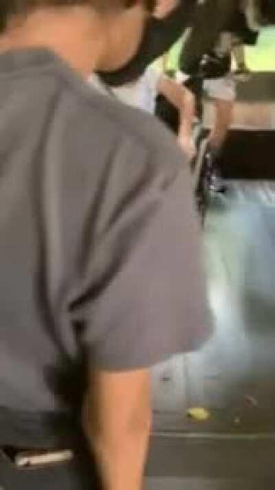 Snake slithering up wheelchair at Singapore Zoo