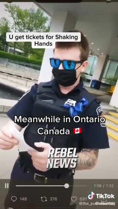 Ticketed for shaking hands. ISYN. Ontario, Canaduba