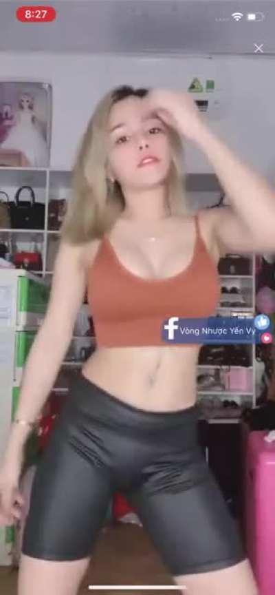 Vietnamese gyrating those hips in tight leather shorts