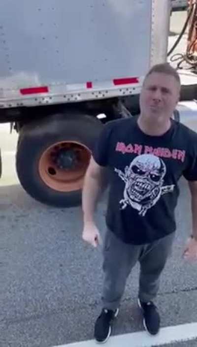 Guy freaks out at UPS driver in the middle of traffic