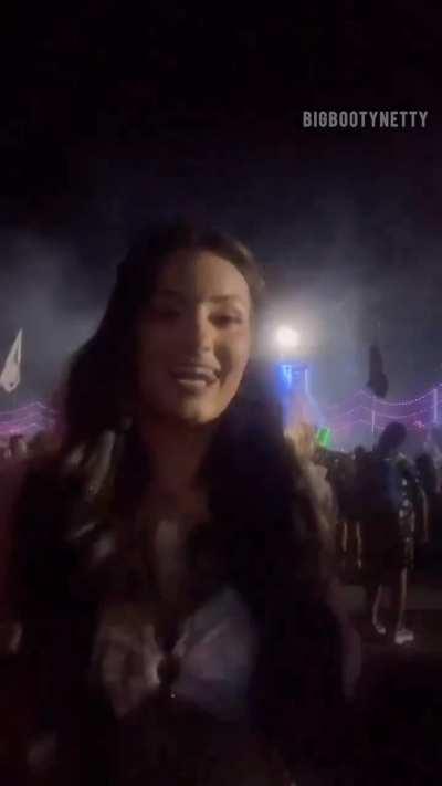 Flashing big tits at a rave