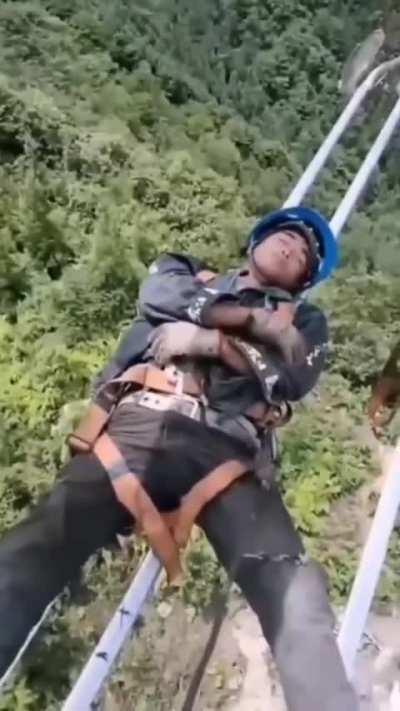 Power line workers in China taking a break in between busy operation shifts.
