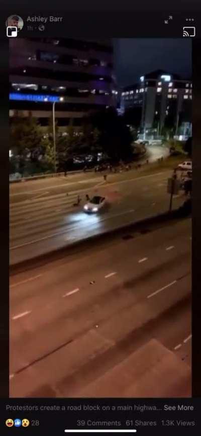 Protestors create a road block on a main highway and two end up getting sent flying only to become meat crayons