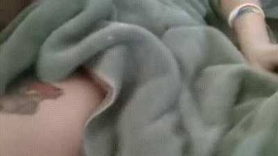 Siblings touch each other while their father is in the room