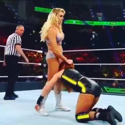Becky Lynch on the knees of her queen is slapped like a disobedient slave