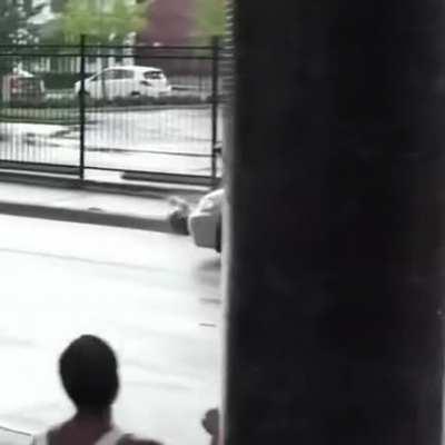 Doing a skateboard trick onto a road.