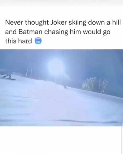 Heading down a snowy hill while catching good pictures relatively close