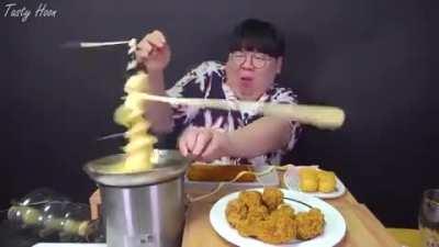 Putting cheese in a chocolate fountain