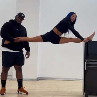 Sasha stretching out with stretch coach