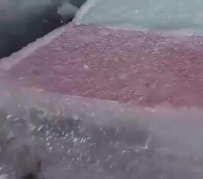 This is the aftermath of what appears to be freezing rain in Vladivostok Russia. Raindrops become supercooled whilst going through a sub-freezing layer of air hundreds of meters above the ground, freezing upon impact with any surface.