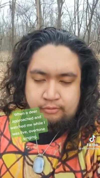 Guy throat sinigng in the woods tries to film deer being curious about his singing. Unknowingly records creepy black firgurs in the trees watching him