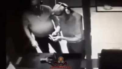 Testing if the gun will shoot, by putting your hand in front of it