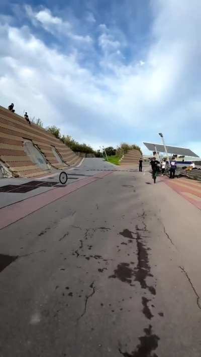 Rider balances a wheelie on a bike with no front wheel