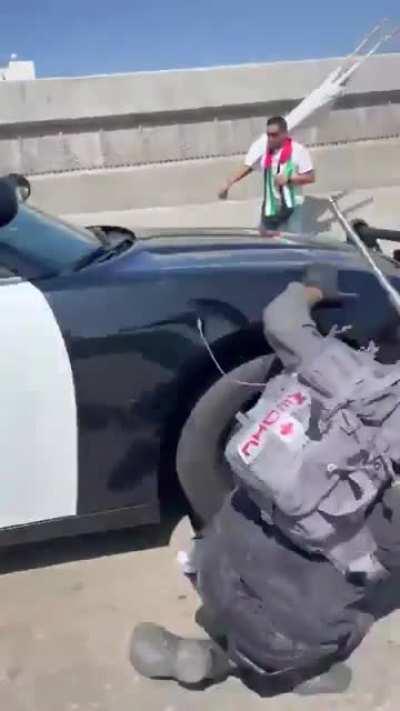 Antifa morons refuse to get out of the way of a cop car at a Pro-Palestine protest.