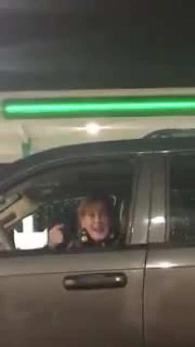 Karen talks to a guy playing Gangster rap in his car.