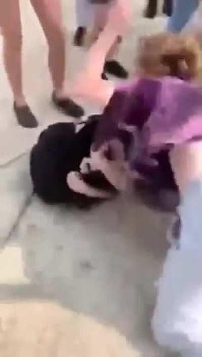 Purple shirt took over + spit on her