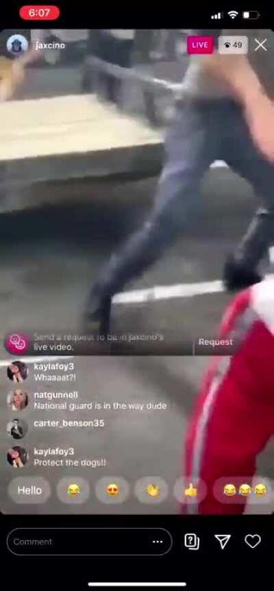 Crazy old man attacks protesters with bow & arrow; his car pays the price.