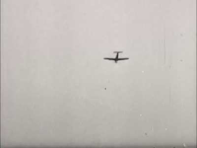 P-47 Thunderbolt fighter-bomber takes a direct hit from German 37mm flak while pulling up from a strafing run in the ETO in 1944