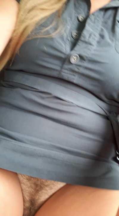 Riding around in a dangerously short dress.