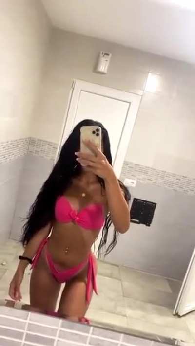 Another view of Mădălina in her pink bikini thong.