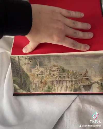 I paint scenes hidden under the gilding of books (fore edge painting). Here’s a beautiful edition of LOTR.