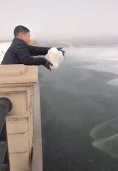 Throwing snow off the bridge
