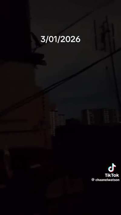 US airstrikes in Venezuela, Caracas. Filmed from a local in the middle of it.