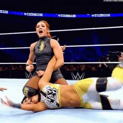 Becky lynch gives bayley a noogie