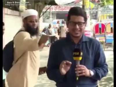 >see messed up collar >fixes it >doesn't elaborate >Leaves  (Dhaka, Bnagladesh)